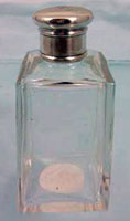 Glass scent bottle with silver top.